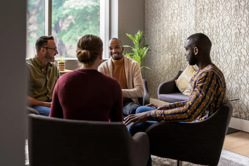 a group of people sitting in chairs