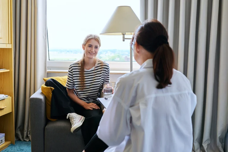 a person talks to a therapist