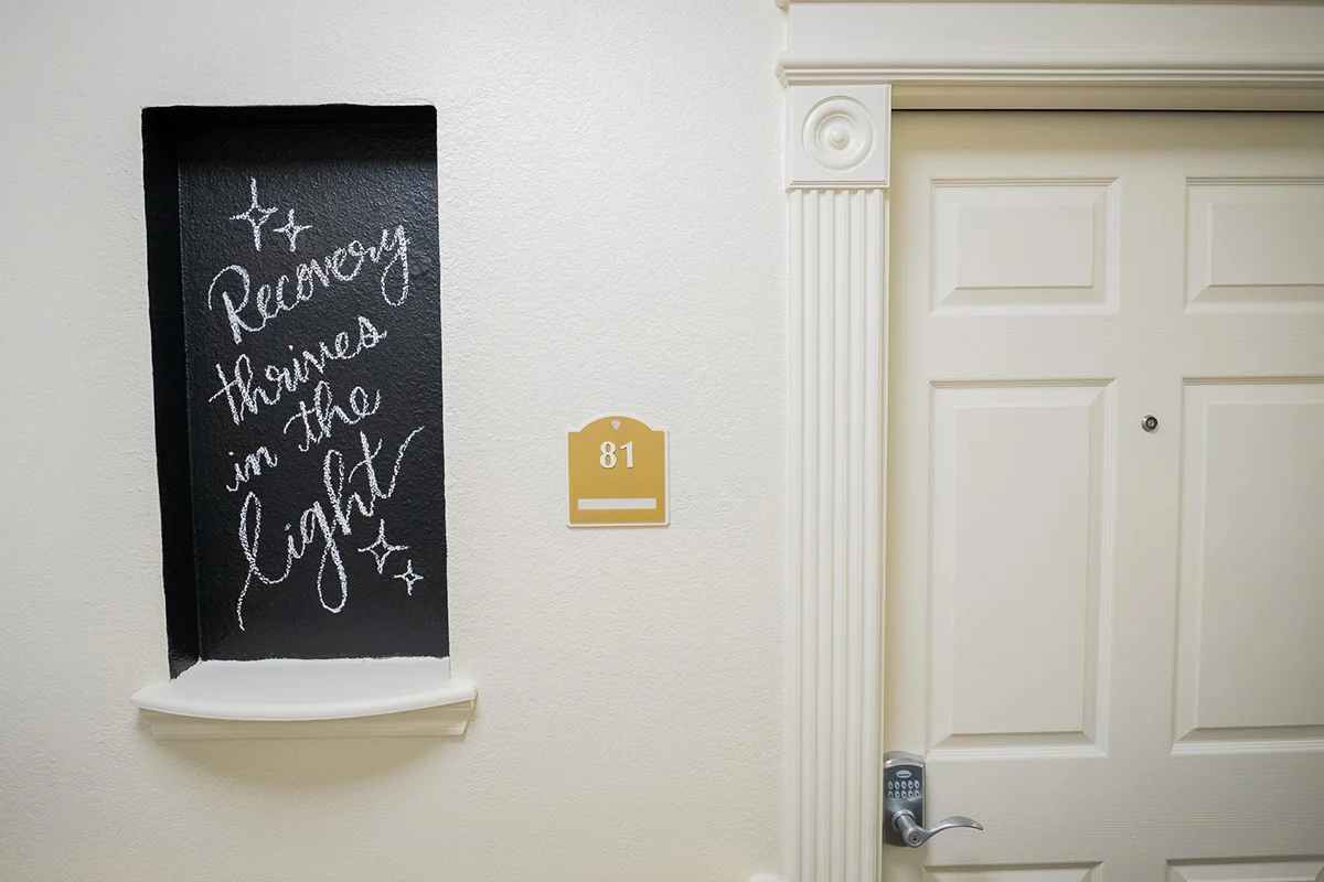 a white door with a blackboard on it