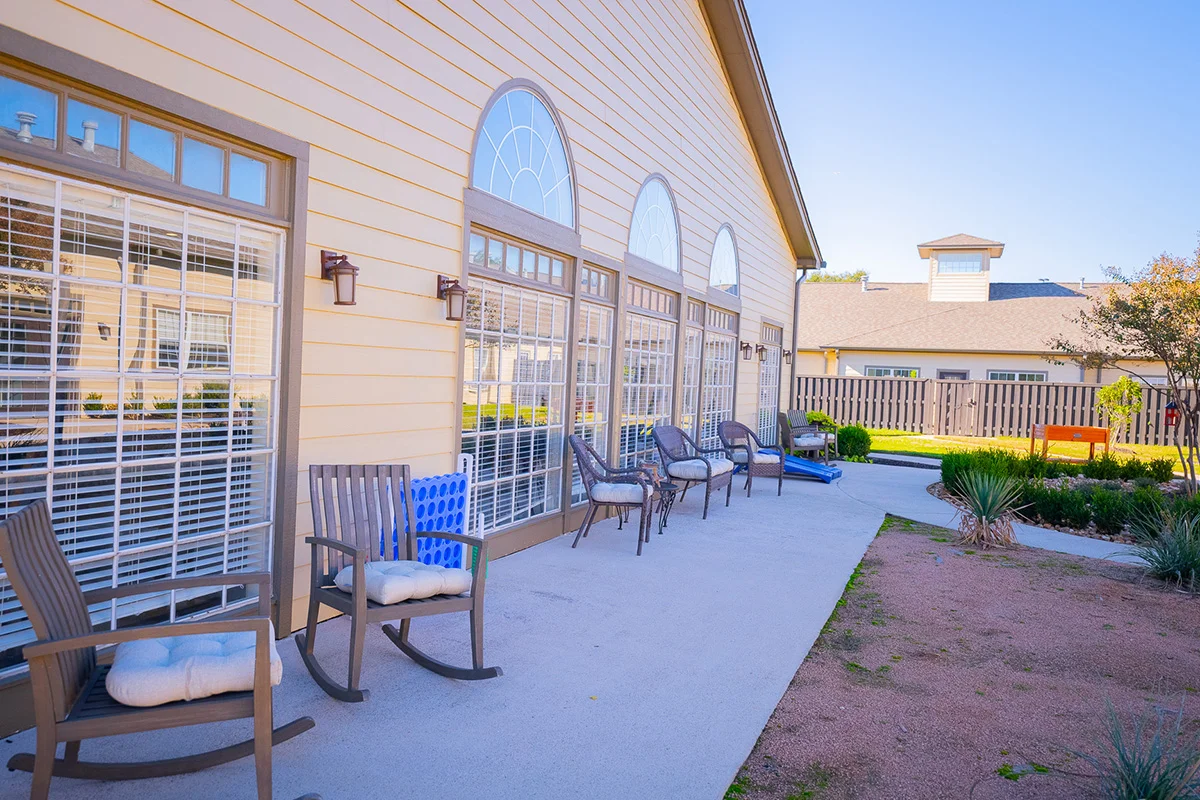 a building with chairs on the patio
