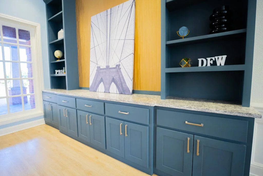 a blue cabinets with a picture on the top