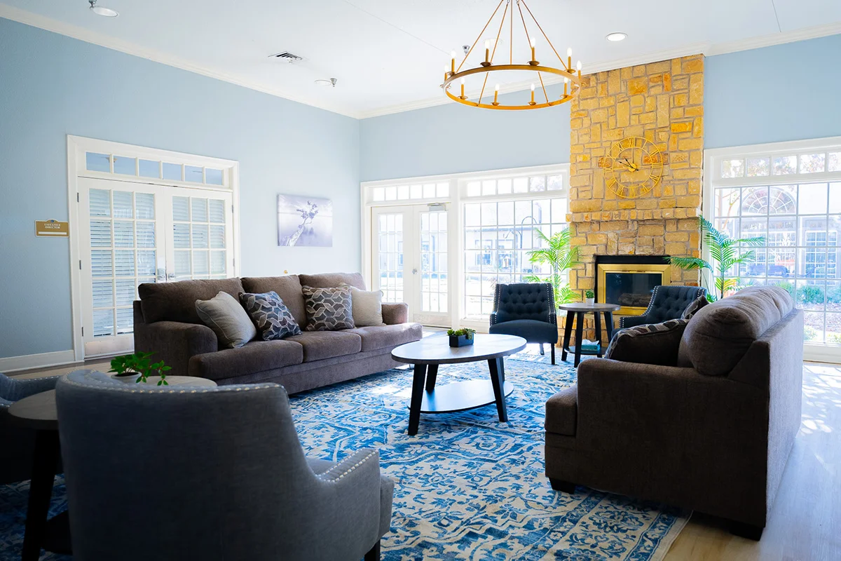 a living room with a fireplace and couches