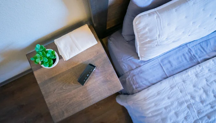 Night stand next to bed